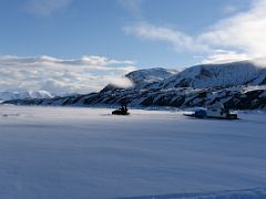 08B A Ski-doo Drags Our Qamutiik Sled Next To Baffin Island As We Near Our Camp On Our Floe Edge Adventure Nunavut Canada